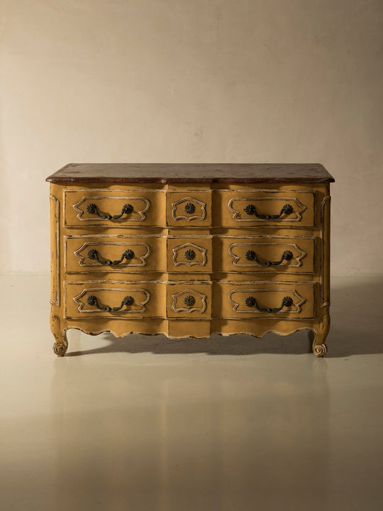 Chest of drawers from the 1920s with yellow and marbled patina