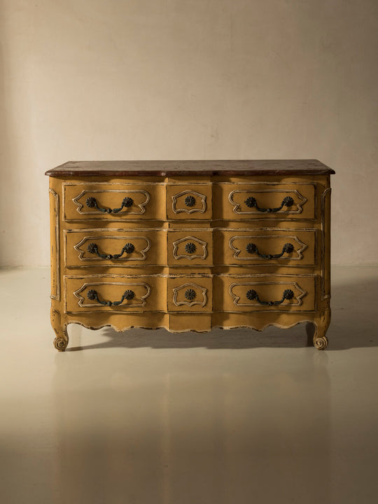 Chest of drawers from the 1920s with yellow and marbled patina
