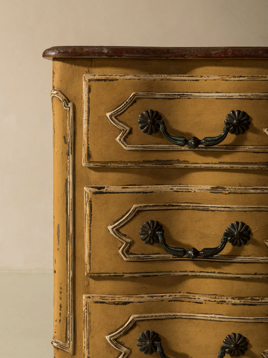 Chest of drawers from the 1920s with yellow and marbled patina