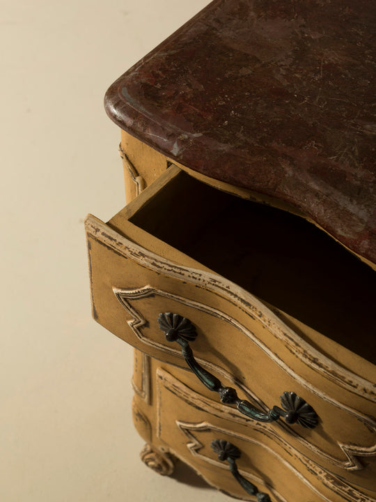 Chest of drawers from the 1920s with yellow and marbled patina