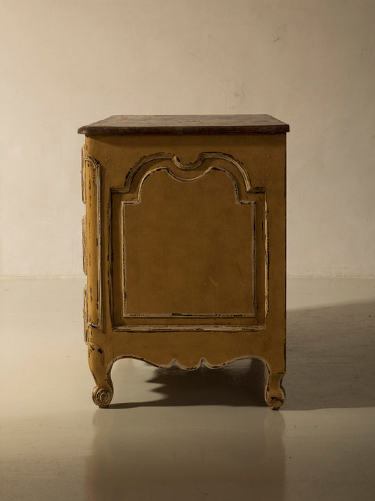 Chest of drawers from the 1920s with yellow and marbled patina