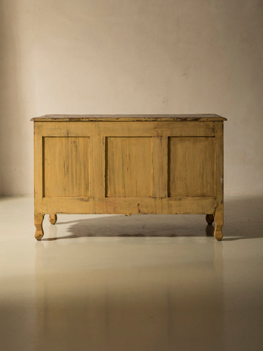 Chest of drawers from the 1920s with yellow and marbled patina