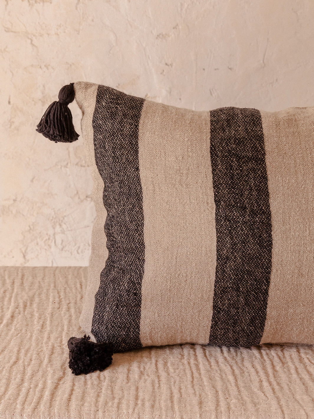 Striped linen cushion with tassels