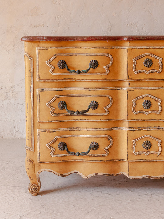 Chest of drawers from the 1920s with yellow and marbled patina