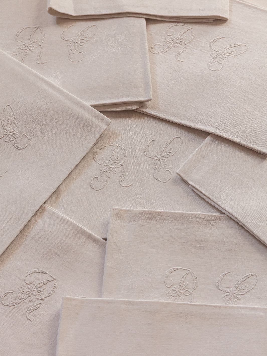 Set of 8 white damask "RC" napkins