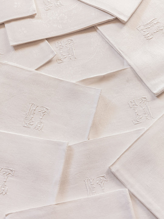 Set de 12 serviettes damassées blanches "TM"