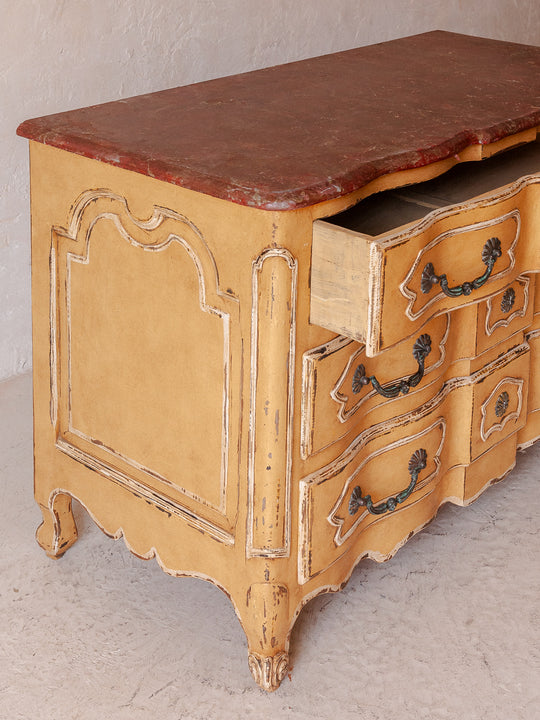 Chest of drawers from the 1920s with yellow and marbled patina