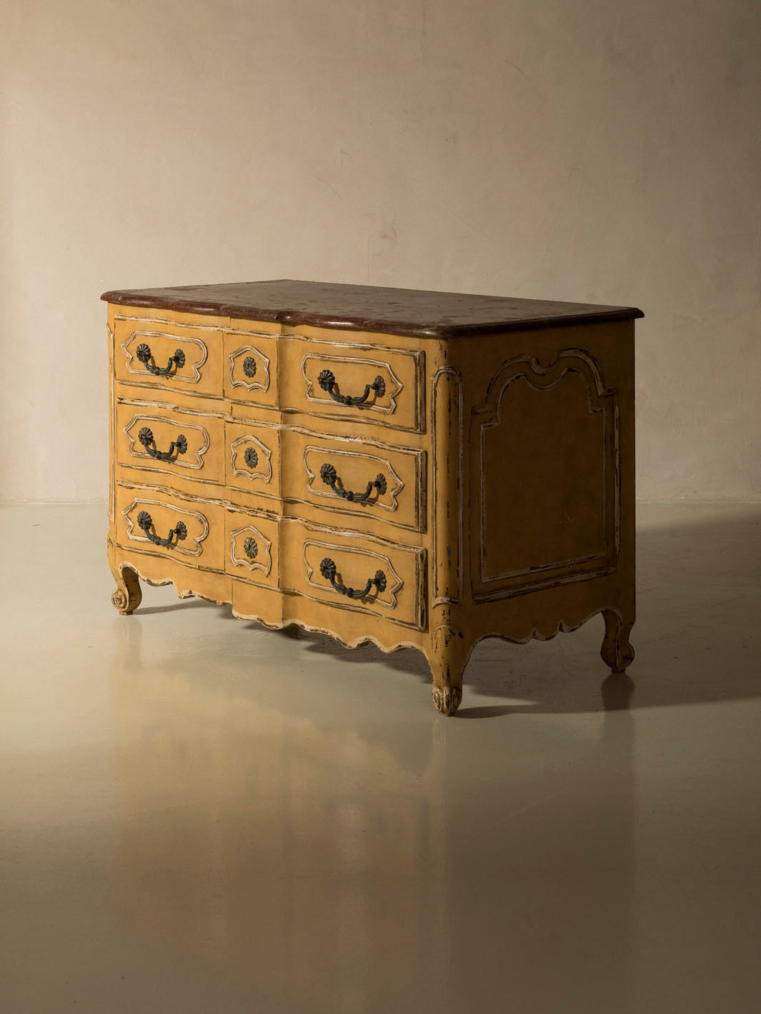 Chest of drawers from the 1920s with yellow and marbled patina