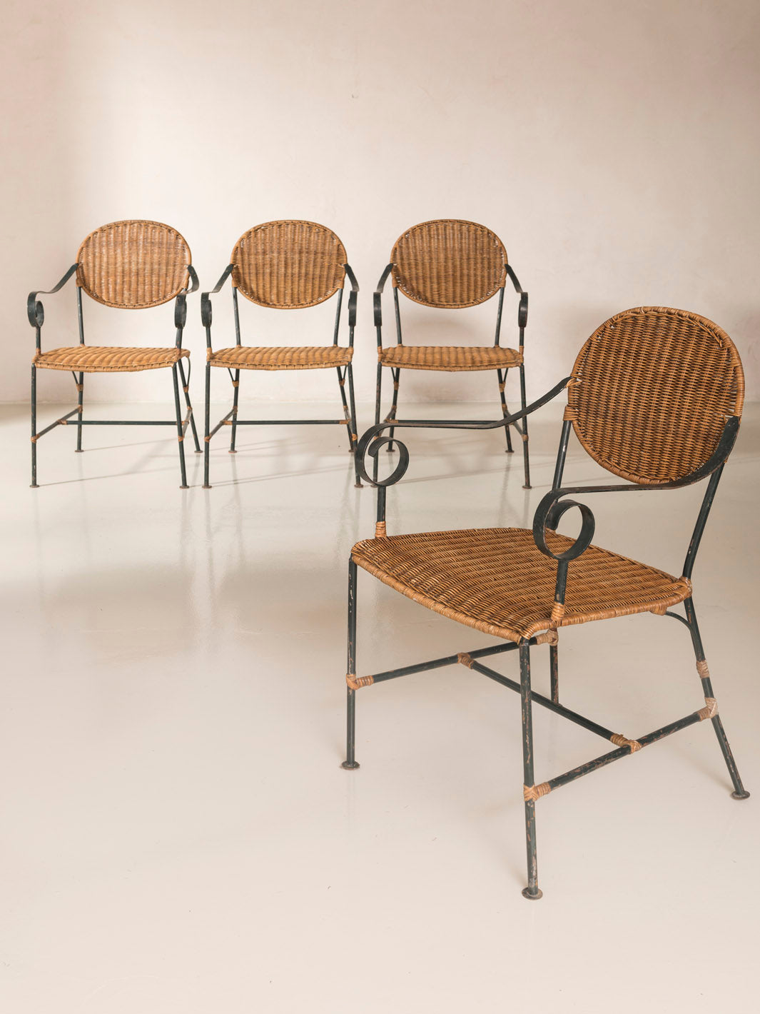 Set of 4 rattan and iron chairs from the 1950s