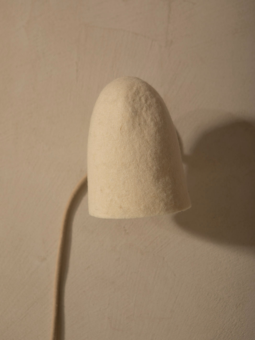 Felt lampshade wall sconce with stoneware basin