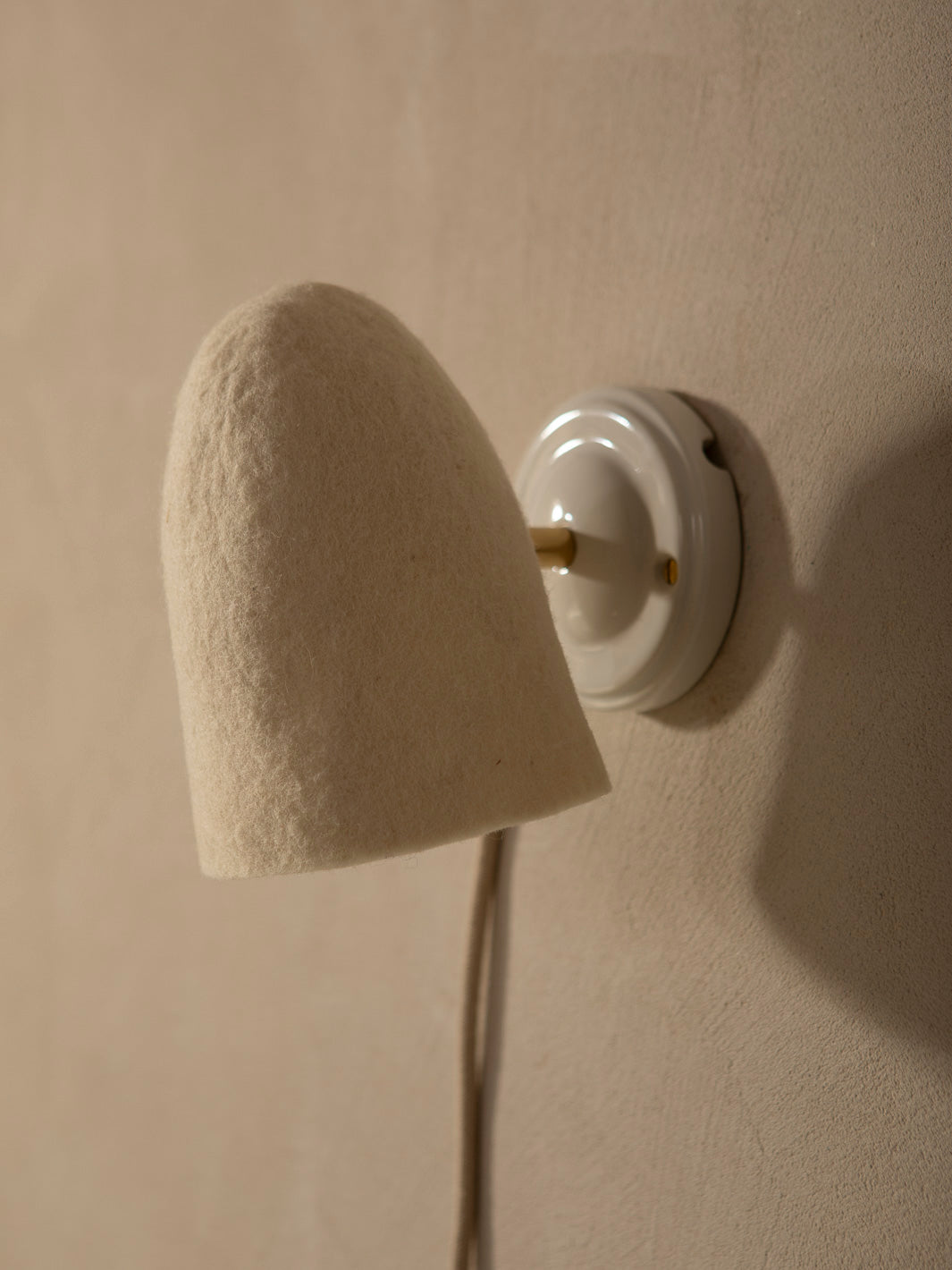 Felt lampshade wall sconce with stoneware basin