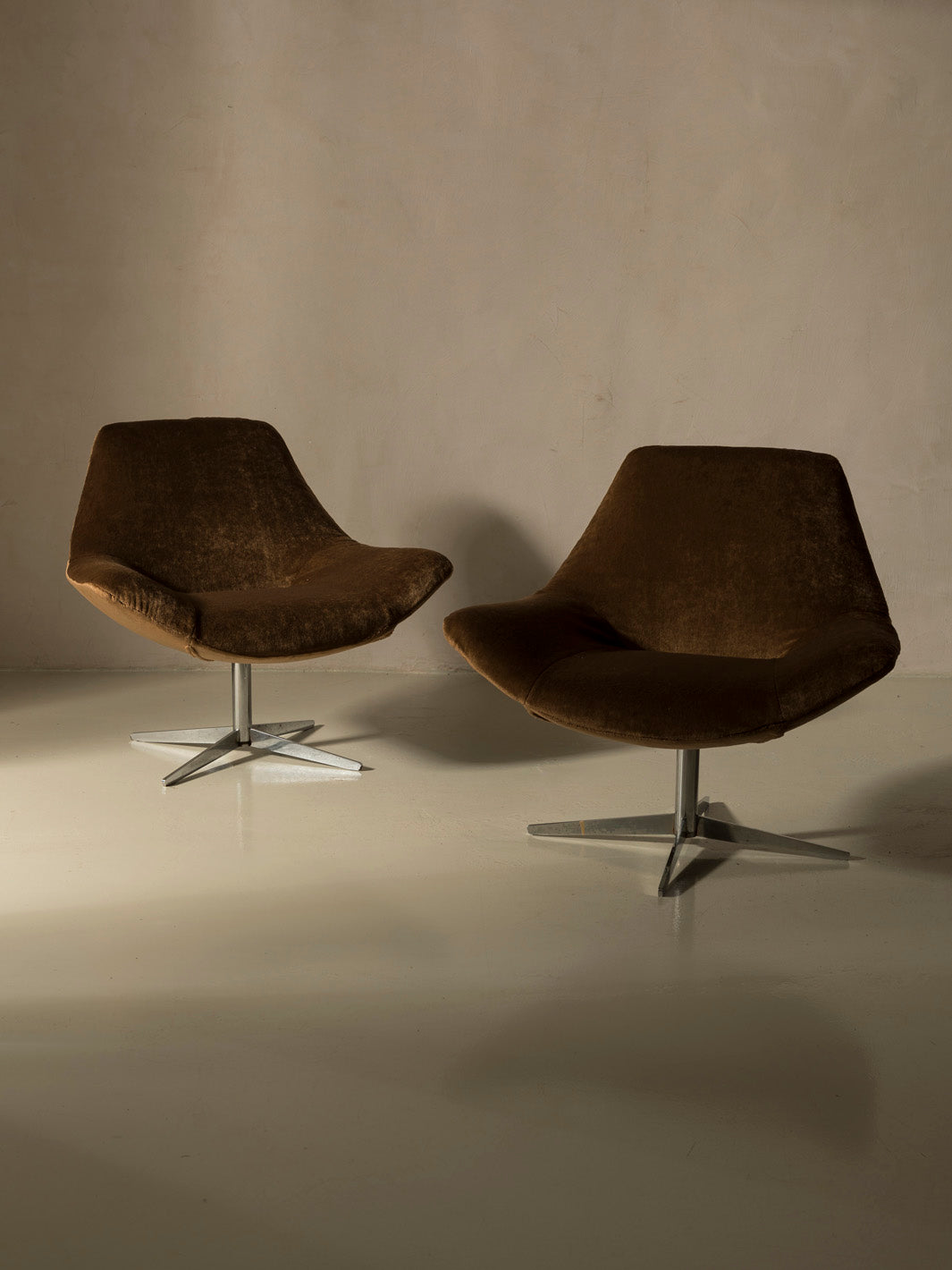 Pair of 60s chrome swivel armchairs