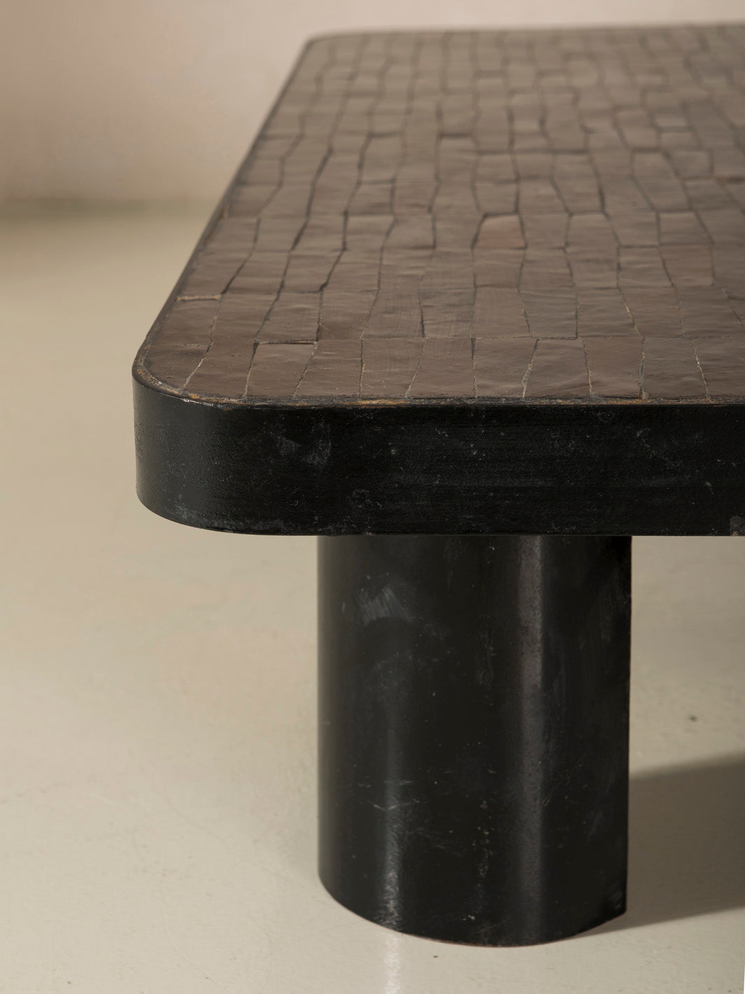 Zellige and iron brown curved low table