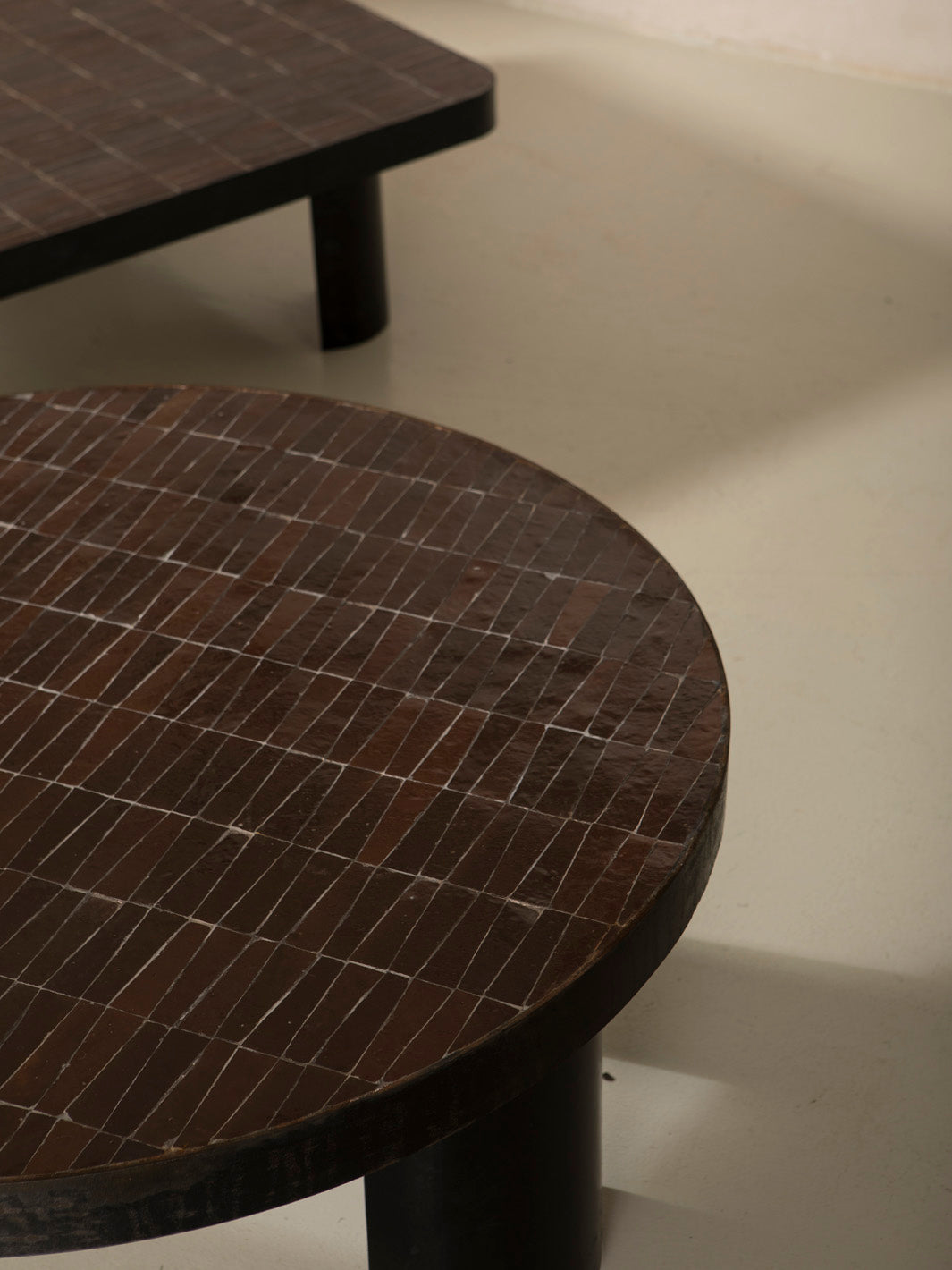 Zellige and iron brown curved low table