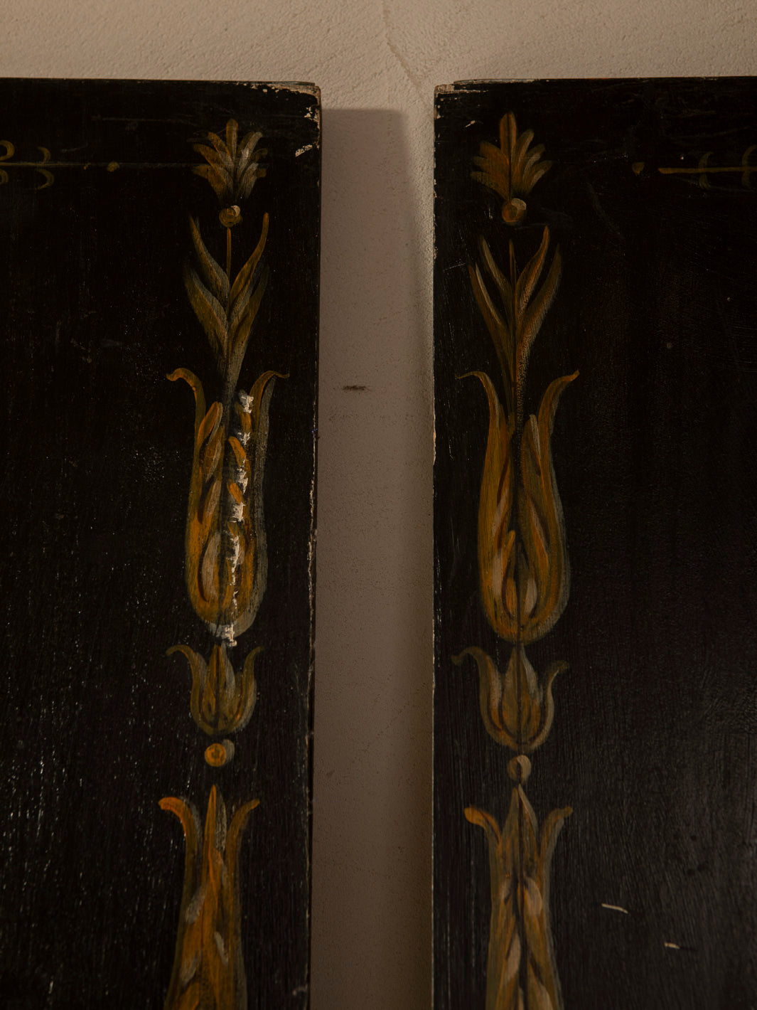 Pair of Florentine panels on a dark background