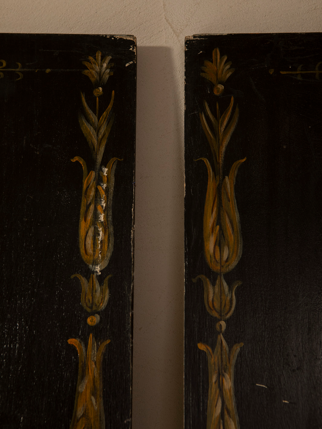 Pair of Florentine panels on a dark background
