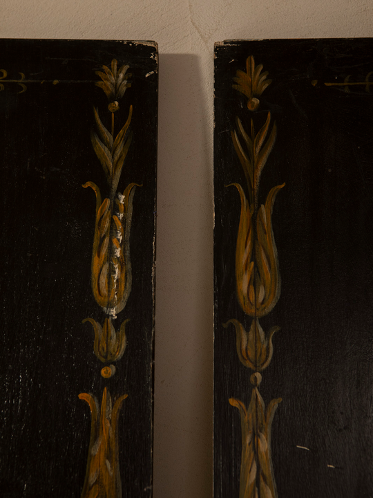 Pair of Florentine panels on a dark background