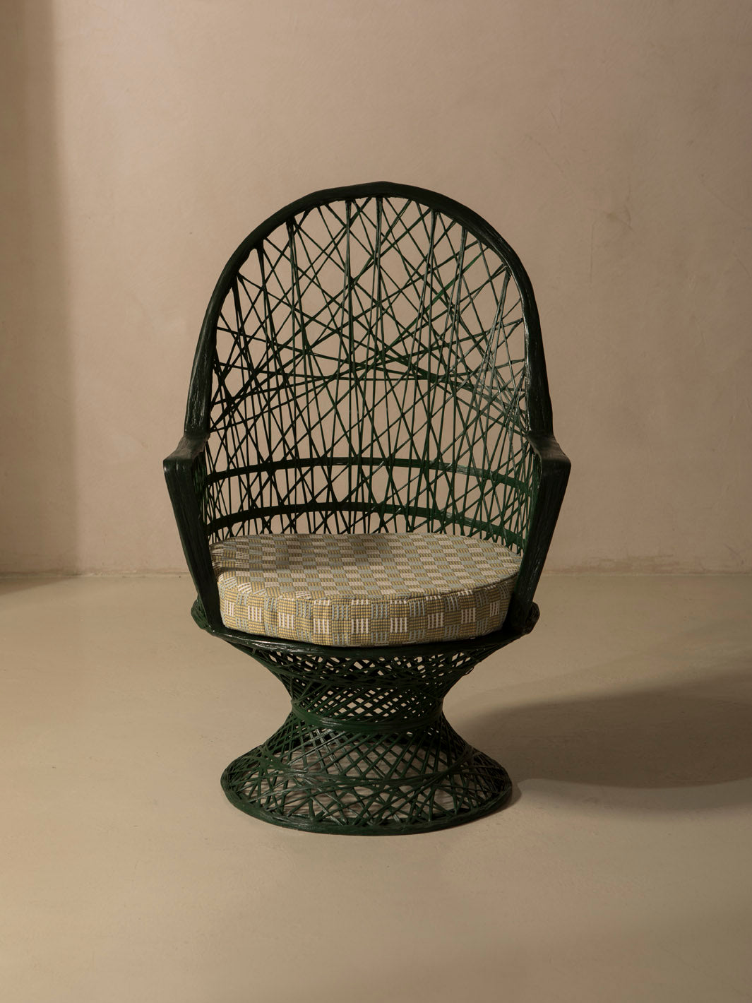 Dark green fiberglass armchair