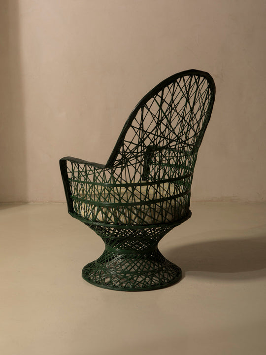 Dark green fiberglass armchair