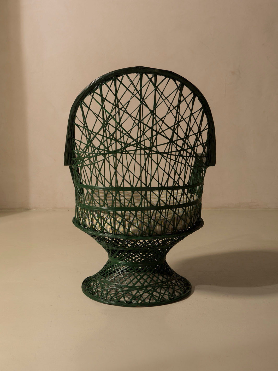 Dark green fiberglass armchair