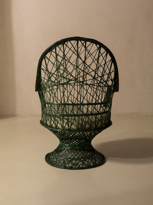 Dark green fiberglass armchair