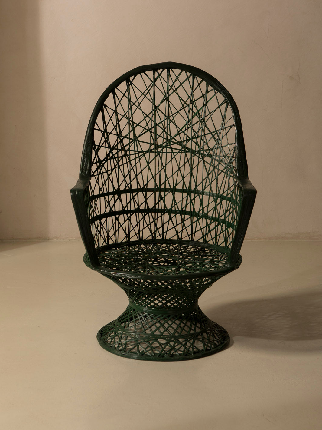 Dark green fiberglass armchair