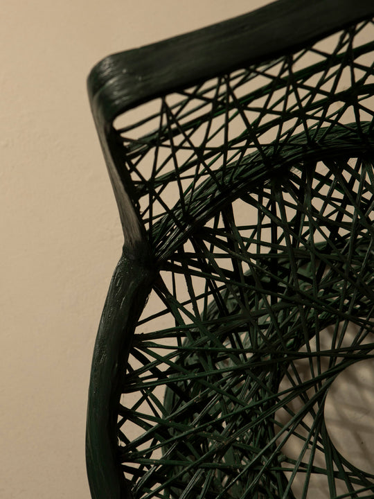 Dark green fiberglass armchair