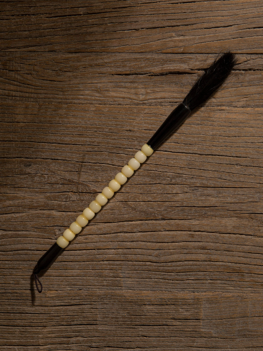 Decorative black and white stone brush