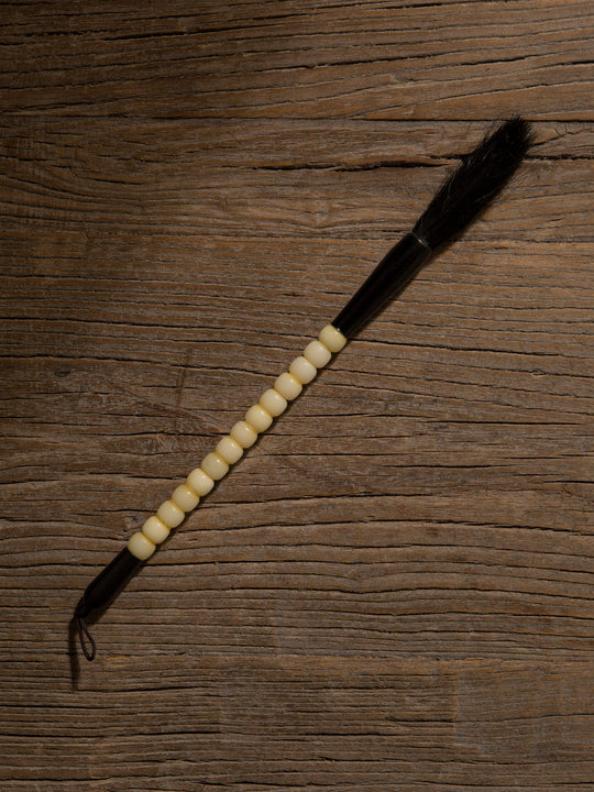 Decorative black and white stone brush