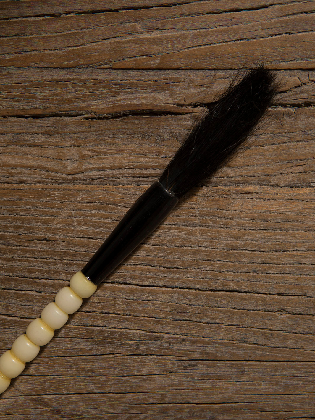 Decorative black and white stone brush