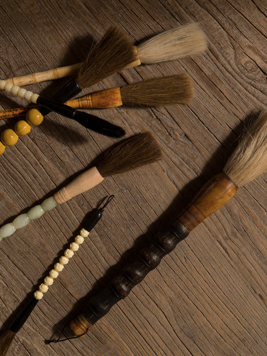 Decorative black and white stone brush