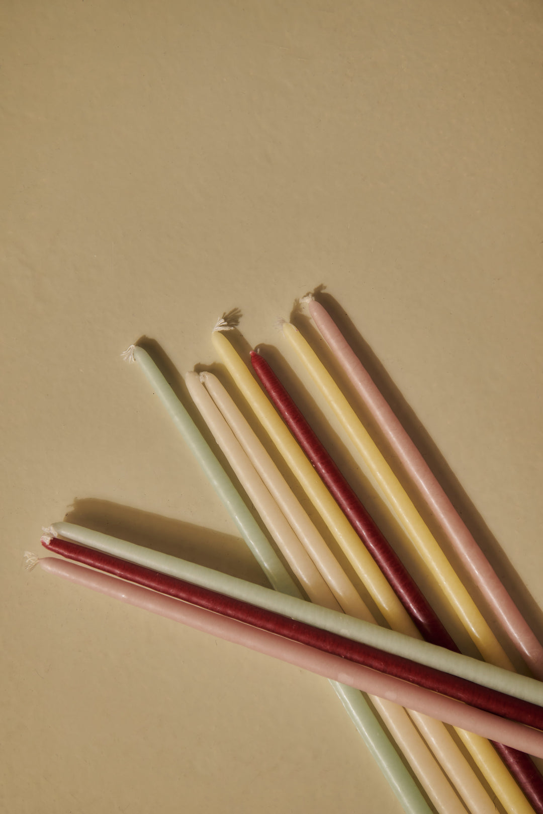Pack of 12 slim pastel candles