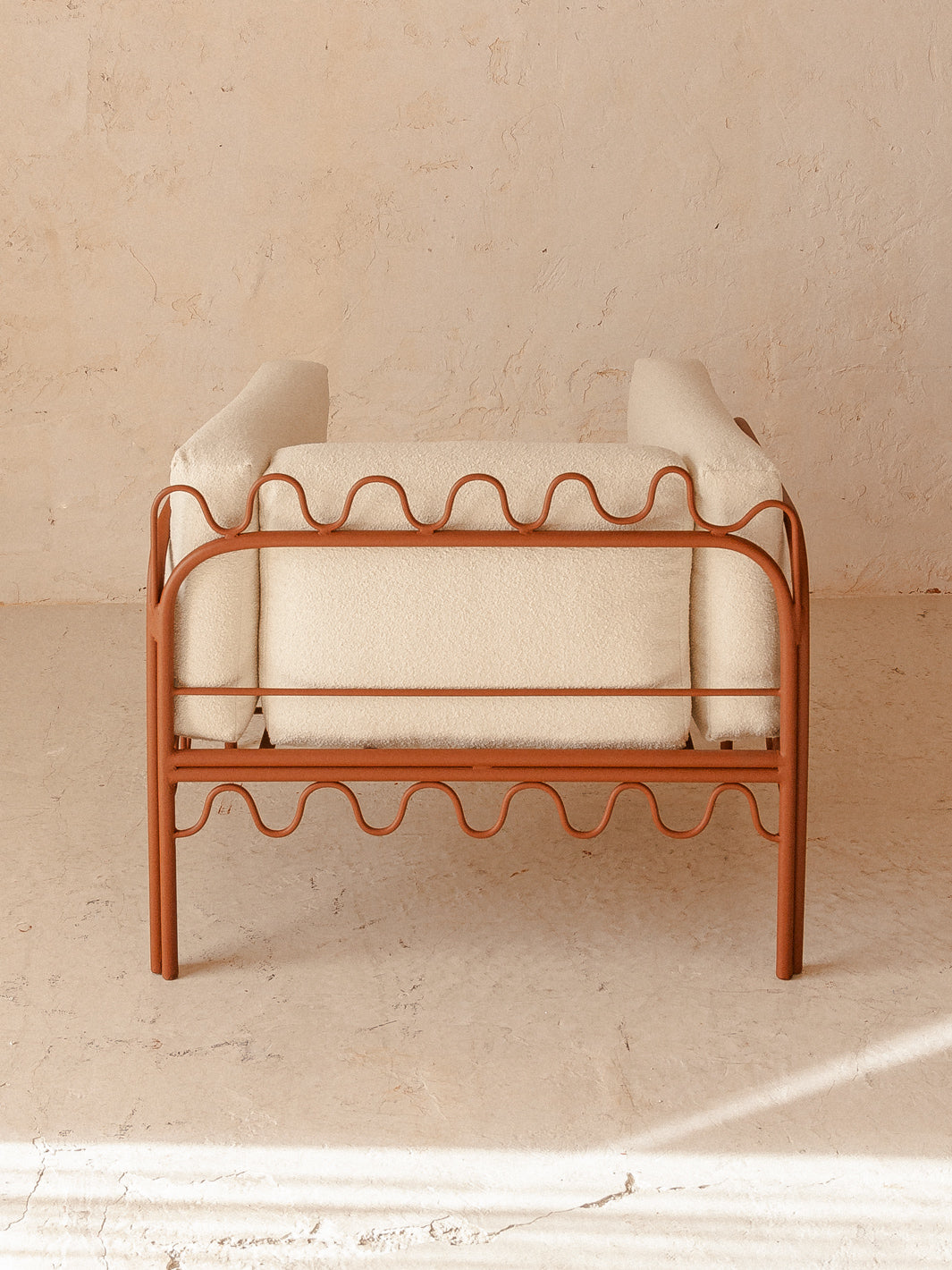 Festoon terracotta and ecru armchair