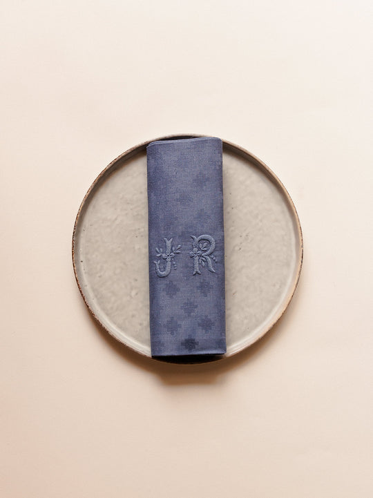 Set of 12 "JR" worn blue damask napkins