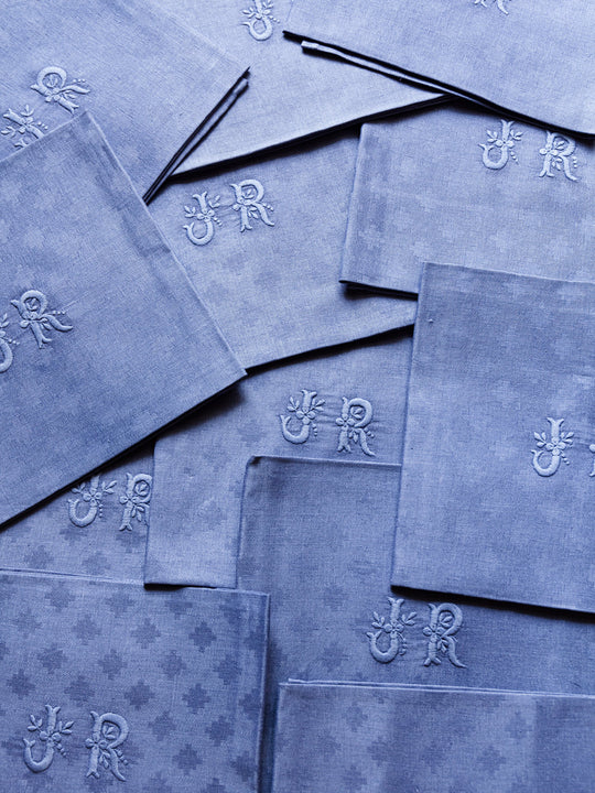 Set of 12 "JR" worn blue damask napkins