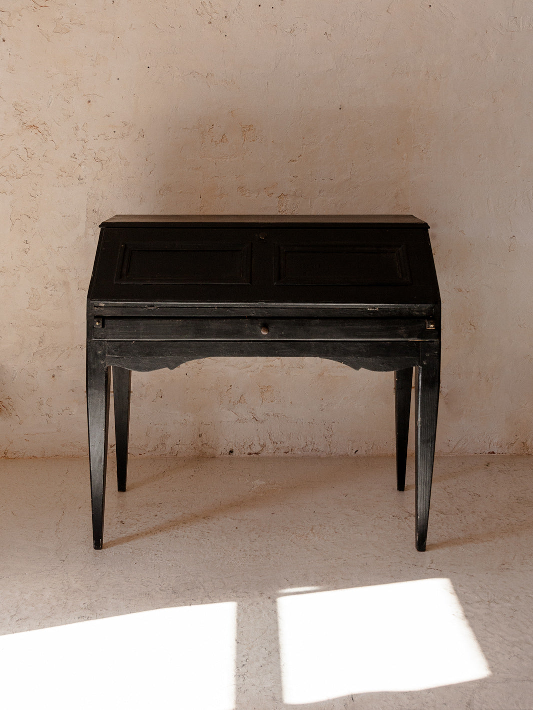 Black French desk and XIX tile