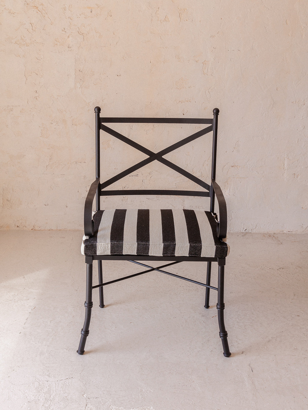 Striped outdoor armchair