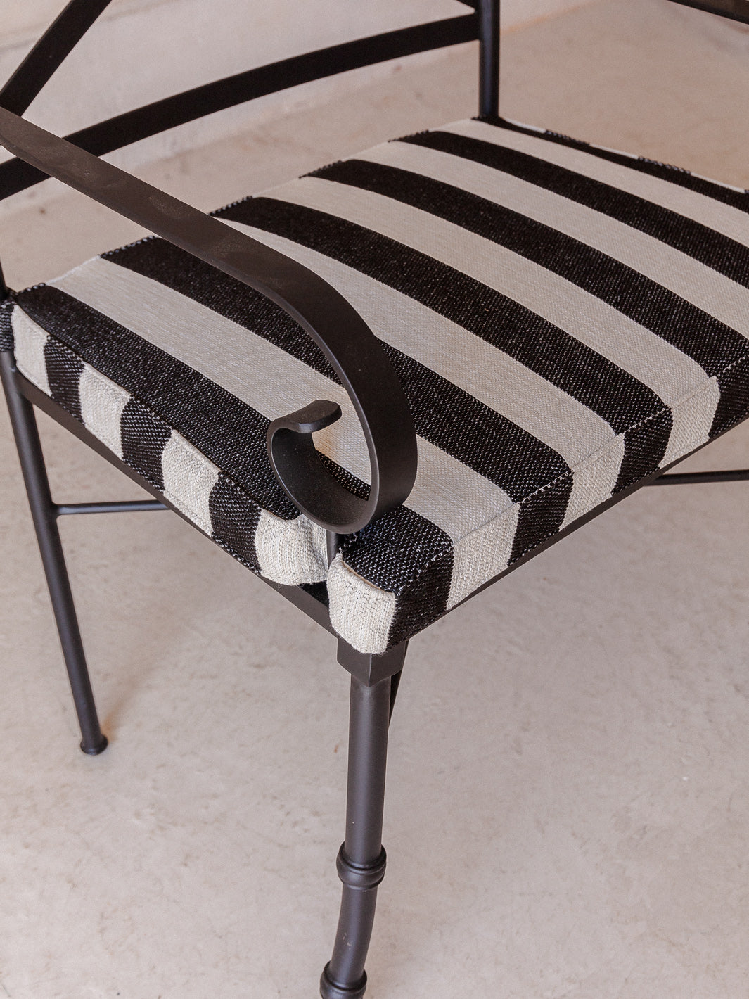 Striped outdoor armchair